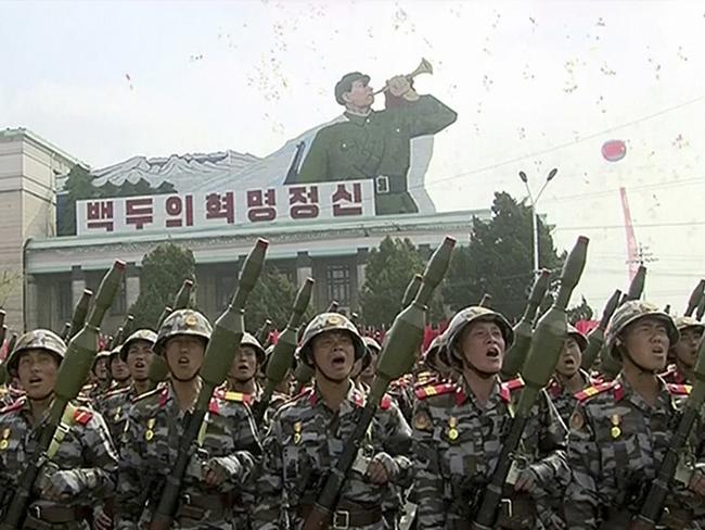 Soldiers take part in a parade at Kim Il Sung Square in Pyongyang, with the projectiles added to the rifles. Picture: AP