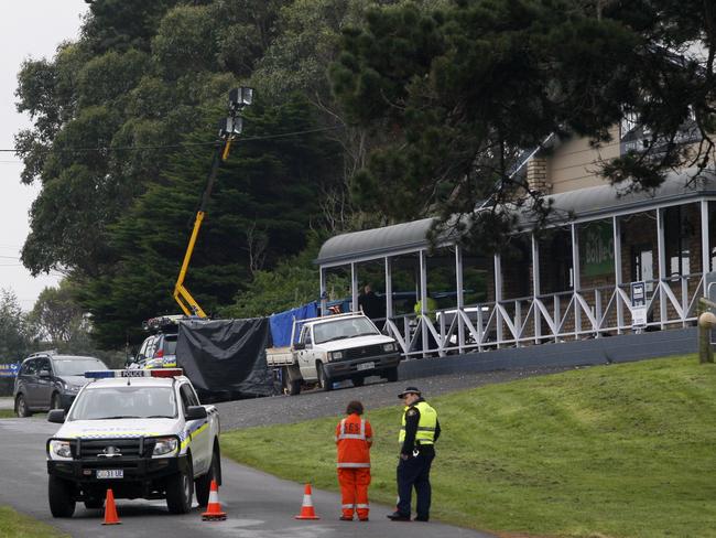 SES and police block the road at the scene.