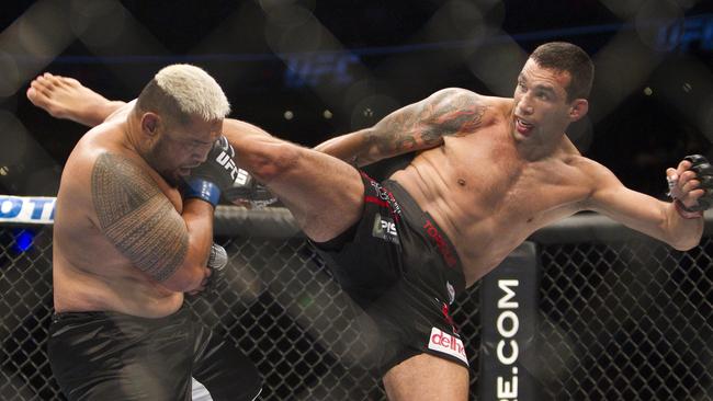 New Zealand's Mark Hunt, left, battles against Brazil's Fabricio Werdum.