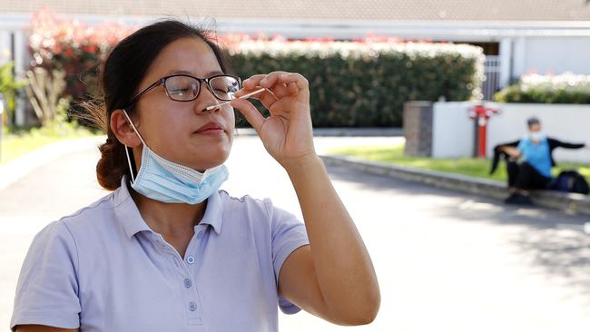 Sydney aged care worker Santoshi Dangol undertaking a rapid antigen test before starting her shift. Picture: Tim Hunter