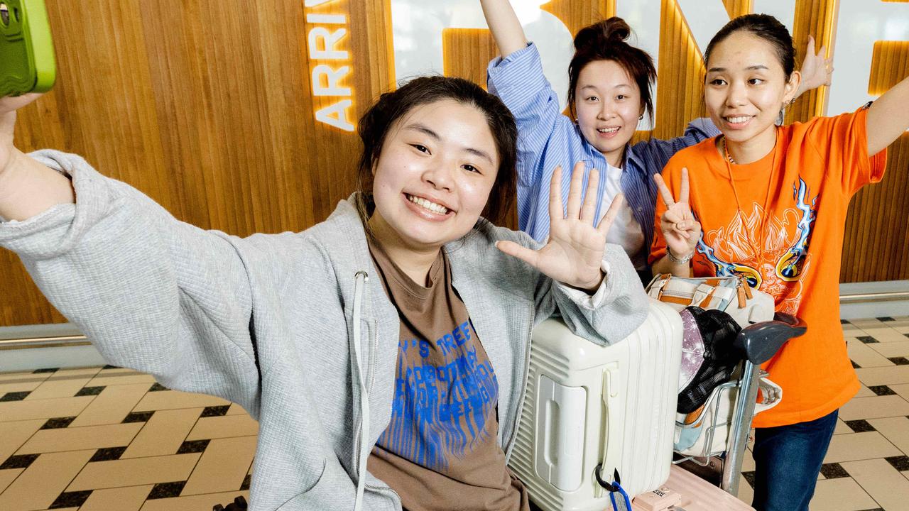 Sheng Yu, Zhang Yitong and Yang Xinyi arrive at Brisbane Airport ahead of the start of the university year this month. Picture: Richard Walker