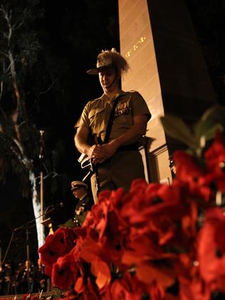 At Parramatta, a member of the Cataflaque party stands perfectly still alongside the cenotaph. Picture: Justin Sanson