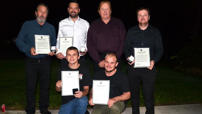 James Hayes with his rescuers. Rohan Merchant, Darcey Heilbronn, Luke Heilbronn, Shannon Camac, and Wayne Merchant were awarded the Queensland Police Service’s District Officer’s Certificate of Appreciation for their heroics. Picture: Natasha Emeck