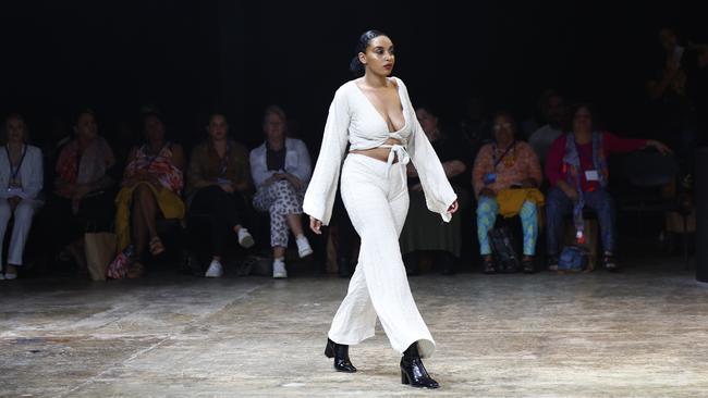 Amariah Savage models the Guyu, Lemon and Rice collection from designers Simone Arnol and Holly McInnes at the Cairns Indigenous Art Fair fashion performance, Woven, held at the Tanks Arts Centre, Edge Hill. Picture: Brendan Radke