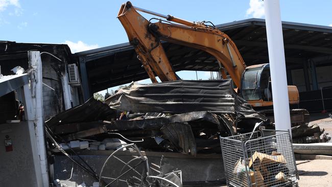 Parts of the NT Oriental Emporium was bulldozed on Monday following a suspicious fire last Thursday. Picture: Katrina Bridgeford.