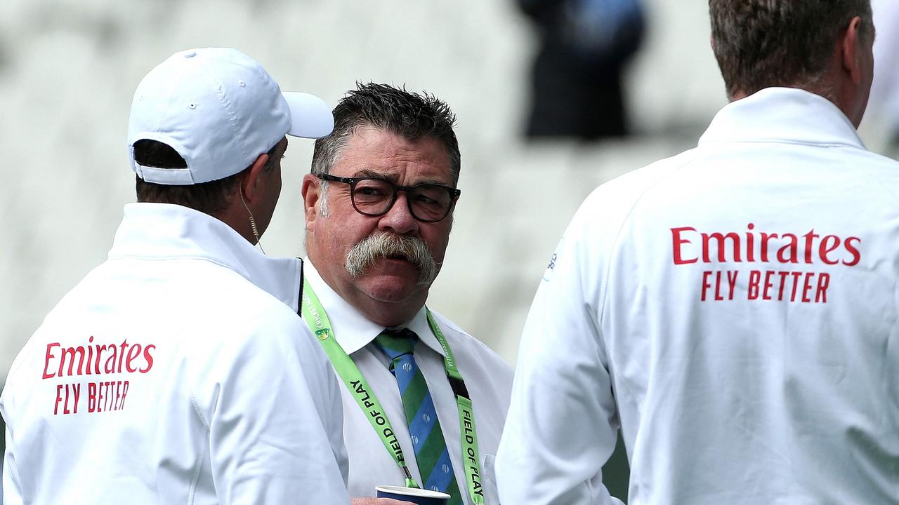 Match referee David Boon speaks with officials during the Boxing Day Test. Picture: Hamish Blair / AFP