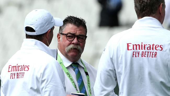 Match referee David Boon speaks with officials during the Boxing Day Test. Picture: Hamish Blair / AFP