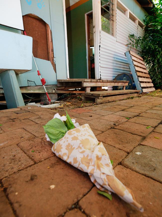 A floral tribute left at the crime scene at Jolly St on Sunday