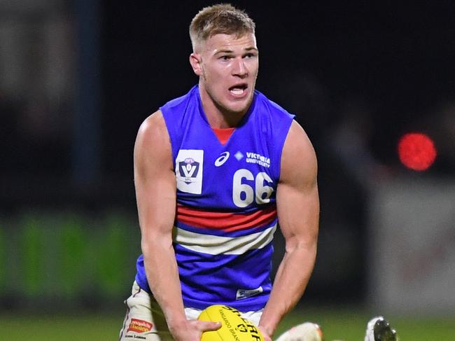 MELBOURNE, AUSTRALIA - MAY 21: Robbie McComb of the Bulldogs runs with the ball during the round six VFL match between Frankston and Footscray at Skybus Stadium on May 21, 2021 in Melbourne, Australia. (Photo by Morgan Hancock/AFL Photos)