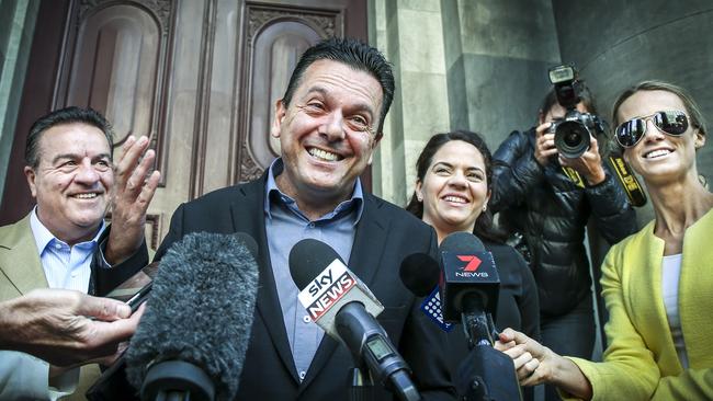 Nick Xenophon, when he was leader of SA-BEST but failed to win a seat, with the party’s newly elected members of the Legislative Council, Connie Bonaros and Frank Pangallo in 2018 on the steps of Parliament House. Picture: AAP / Mike Burton