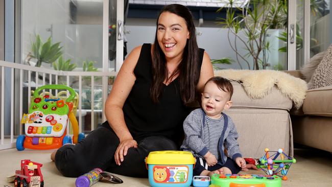 Carla Zipper, 36, with her son 11-month-old Evan at their Manly unit. She is looking to buy a bigger home after selling her investment property. 