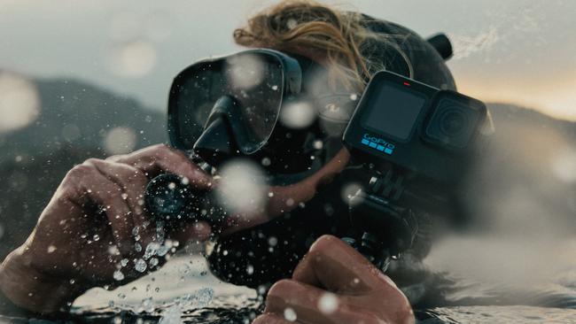 A snorkeller takes the new GoPro HERO11 underwater.