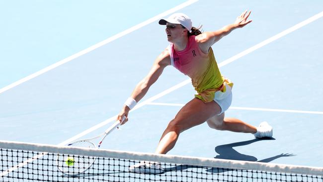 Poland’s Iga Swiatek stretches to return a shot against American Emma Navarro in their Australian Open quarter-finals match on Rod Laver Arena Picture: Mark Stewart