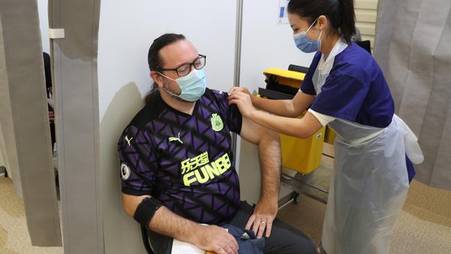 Mike Lavery gets his COVID-19 jab at the vaccination centre in Melbourne Showgrounds. Picture: NCA NewsWire / David Crosling