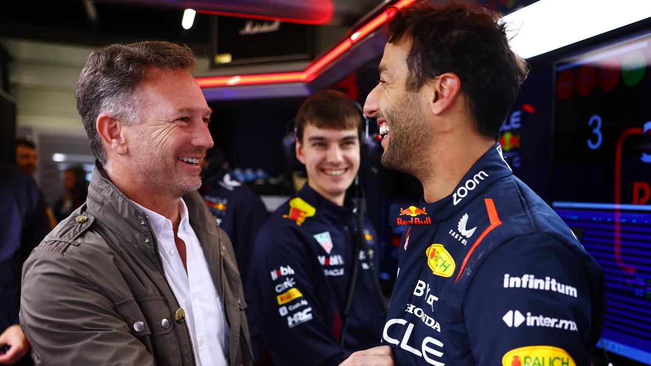 NORTHAMPTON, ENGLAND - JULY 11: Daniel Ricciardo of Australia and Oracle Red Bull Racing speaks with Red Bull Racing Team Principal Christian Horner as he prepares to drive during Formula 1 testing at Silverstone Circuit on July 11, 2023 in Northampton, England. (Photo by Mark Thompson/Getty Images)