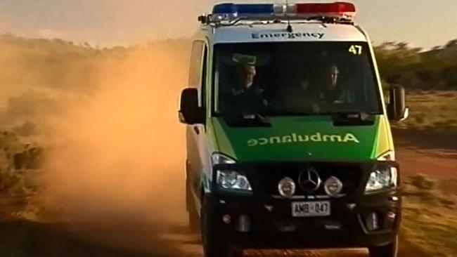 An ambulance heads to Oulnina Park, north east of Yunta, where police were questioning Michael Burdon. Picture: Seven News