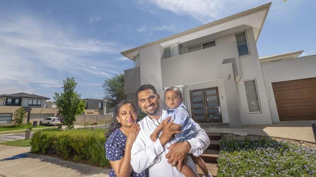 Young Werribee family Bhavani Mohan, Hariprasath Ravi and Tishan Hariprasath (1) outside their new Werribee home, which they bought in November. Picture: Rob Leeson