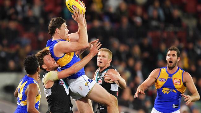 Jeremy McGovern of the Eagles pulls down the match-winning mark over Brad Ebert after going forward in the final minute against Port Adelaide. Picture: Daniel Kalisz/Getty Images)