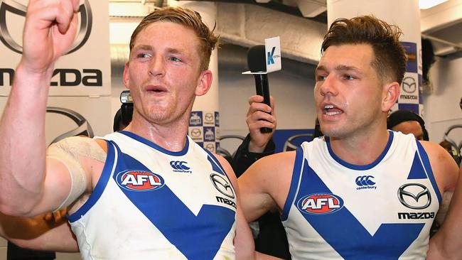 Higgins celebrates Saturday night’s win with captain Jack Ziebell. Picture: Getty Images