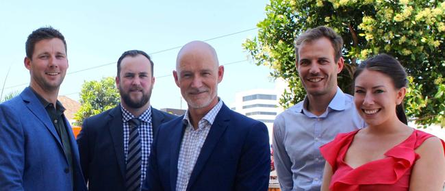 New Southport Chamber of Commerce president Ian Kennedy (centre) is opposed to the central chamber renaming itself the Gold Coast Chamber of Commerce.