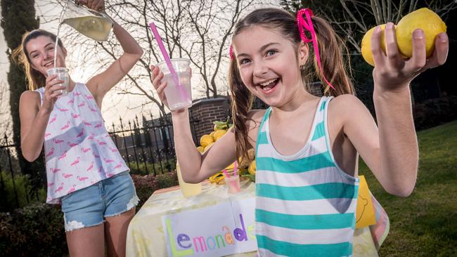 Sisters Giselle and Claudia love holding lemonade stands to raise money. Picture: Jake Nowakowski