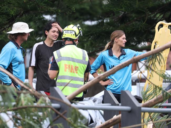 Surf lifesavers were the first on the scene at the deadly tree fall. Picture John Grainger