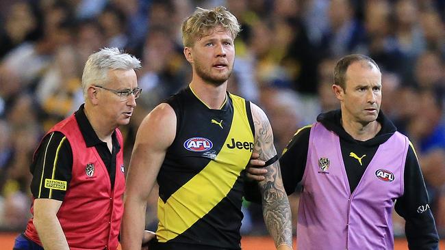 Nathan Broad is helped off the ground after suffering concussion. Picture: Mark Stewart