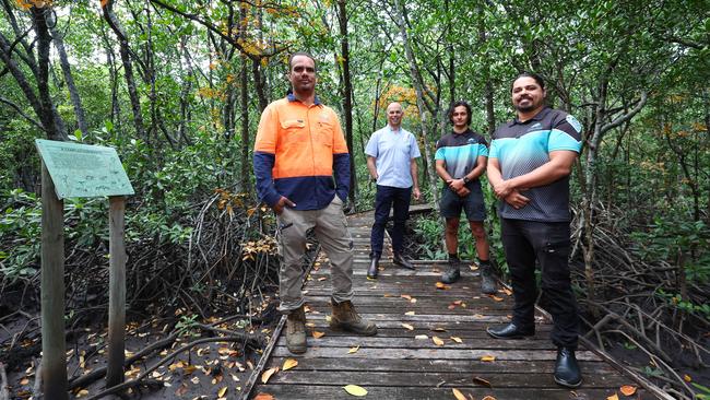 Cairns Airport CEO Richard Barker and Lachlan Mitchell and Gavin Singleton from the Yirrganydji Land and Sea Rangers on the boardwalk among the mangroves. Picture: Brendan Radke