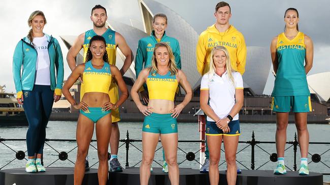 (Back L to R) Holly Lincoln-Smith, Adam Gibson, Madison Wilson, Kyle Chalmers, Stephanie Talbot, (Front L to R) Morgan Mitchell, Sally Pearson and Brooke Stratton unveil the official uniforms to be worn by the Australian Olympic team during the 2016 Rio Olympic Games in front of the Sydney Opera House. Pic Brett Costello