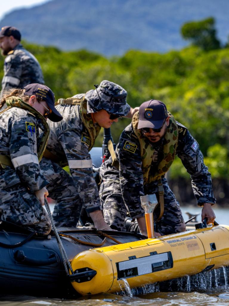 Royal Australian Navy sailors lower a Bluefin-9 autonomous underwater vehicle into Cairns Inlet near HMAS Cairns as part of Exercise Austral Shield 2024. Picture: CPL Michael Currie.