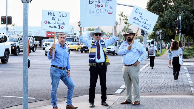 Member for Kennedy Bob Katter and two of his Far North Queensland candidates for the state election have held a mini protest outside of the Cairns Performing Arts Centre, furious that the Queensland Government is spending billions in South East Queensland for the 2032 Olympics Games, while regional Queensland will recieve a fraction of the funding. Katter Australian Party candidate for Cook Duane Amos, Member for Kennedy Bob Katter and KAP candidate for Mulgrave Steve Lesina timed their mini protest to coincide with a Brisbane 2032 organising committee meeting at CPAC. Picture: Brendan Radke