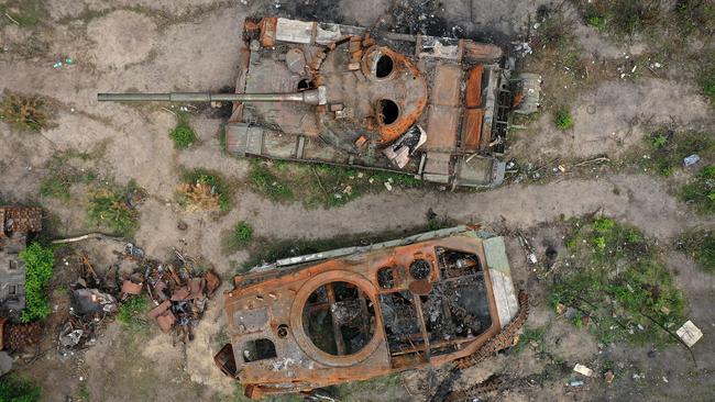 Destroyed Russian main battle tanks and armoured vehicles lay beside a road on May 25, 2022 in Irpin, Ukraine. Picture: Christopher Furlong/Getty Images.