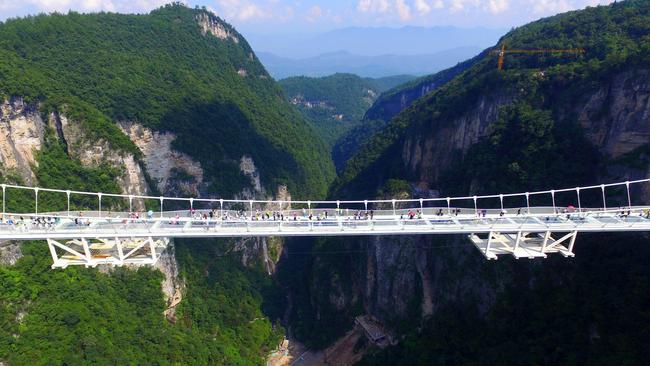 The bridge hangs 300m above the canyon. Picture: Chinatopix via AP