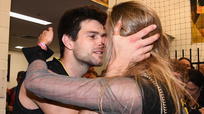 Trent Cotchin kisses his wife after the preliminary final win. (Photo by Quinn Rooney/Getty Images)