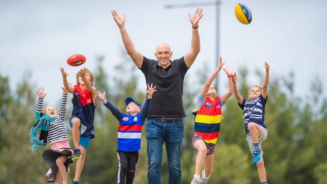 Pearl, 5, Oscar, 8, Harrison, 5, former AFL player James Podsiadly, Grace, 8, and Ollie, 6. Picture: Jason Edwards