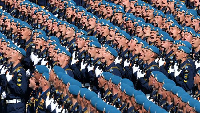 Russian soldiers march through Red Square during the Victory Day military parade in Moscow on May 9, 2015. Russian President Vladimir Putin presides over a huge Victory Day parade celebrating the 70th anniversary of the Soviet win over Nazi Germany, amid a Western boycott of the festivities over the Ukraine crisis. AFP PHOTO / POOL / HOST PHOTO AGENCY RIA NOVOSTI
