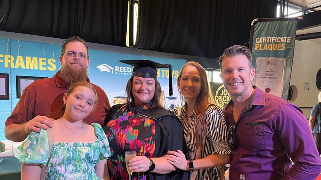 Graduates from the University of the Sunshine Coast's Fraser Coast campus celebrating at the Brolga Theatre.