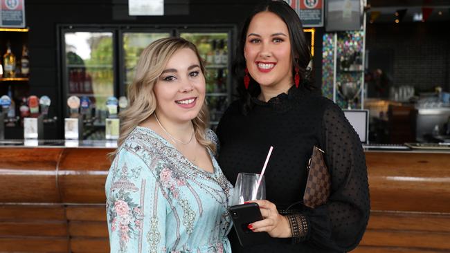 Liesle Wilde (in blue) and Jasmine Ware looked stunning at the Panthers outdoor bar on Melbourne Cup Day.