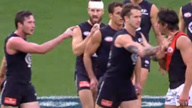 Jed Lamb (left) remonstrates with Essendon’s Mark Baguley at three-quarter time of Saturday’s match.