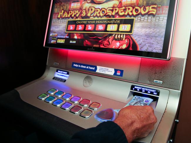 SYDNEY, AUSTRALIA - Newswire Photos November 02, 2022; A general stock view of a man playing the poker machines at a gaming room at a pub in Sydney as the gambling laws change today. Picture: NCA Newswire / Gaye Gerard