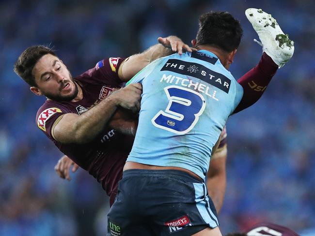NSW Latrell Mitchell throws off Queensland's Ben Hunt during Game 2 of the State of Origin series between the NSW Blues and Queensland Maroons at the ANZ Stadium, Sydney. Picture. Phil Hillyard