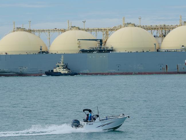 A generic photo of a an amateur Fisherman passing an LNG ship in Darwin Harbour, Gas , Exports , recreational fishingPicture: Glenn Campbell