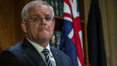 Scott Morrison white-knuckled his way through a press conference after the first interest rates rise in a decade. Picture: Jason Edwards