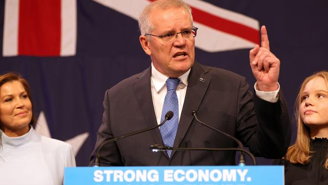 Scott Morrison delivers his concession speech on election night in 2022, watched by wife Jenny. Picture: Getty Images