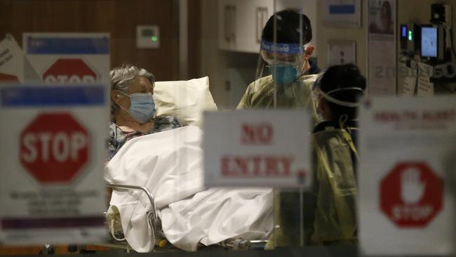 A resident of Epping Gardens Aged Care Facility is taken away in an ambulance on Tuesday in Melbourne, Picture: Darrian Traynor/Getty Images