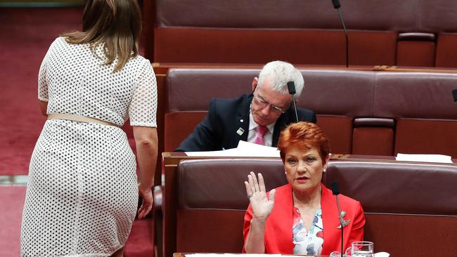 Sarah Hanson-Young gets a ‘talk to the hand’ from Pauline Hanson. Picture: Kym Smith