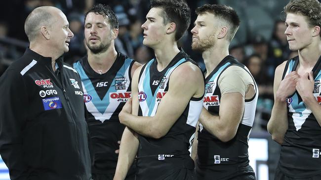 TOUGH LOSS: Port Adelaide coach Ken Hinkley consoles his charges after the one-point loss to GWS at Adelaide Oval on Saturday night. Picture: SARAH REED.