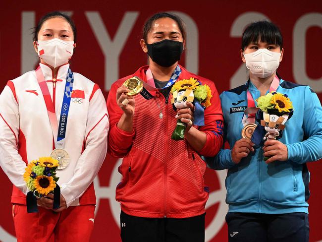 (L-R) Silver medallist China's Liao Qiuyun, gold medallist Philippines' Hidilyn Diaz and bronze medallist Kazakhstan's Zulfiya Chinshanlo. Picture: Vincenzo Pinto/ AFP)