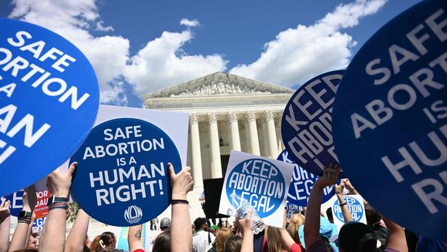 Reproductive rights activists demonstrate in front of the Supreme Court in Washington, DC.