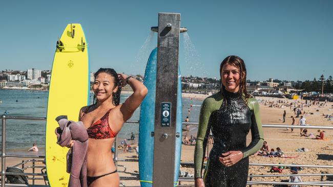 Sophie Marriott and Chanel Cheung soaking up the sun at Bondi Beach on Sunday morning. Picture: NCA NewsWire/Flavio Brancaleone